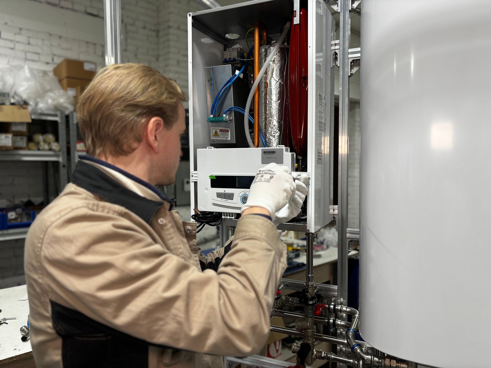 Technician working on a heating system for a heating service page