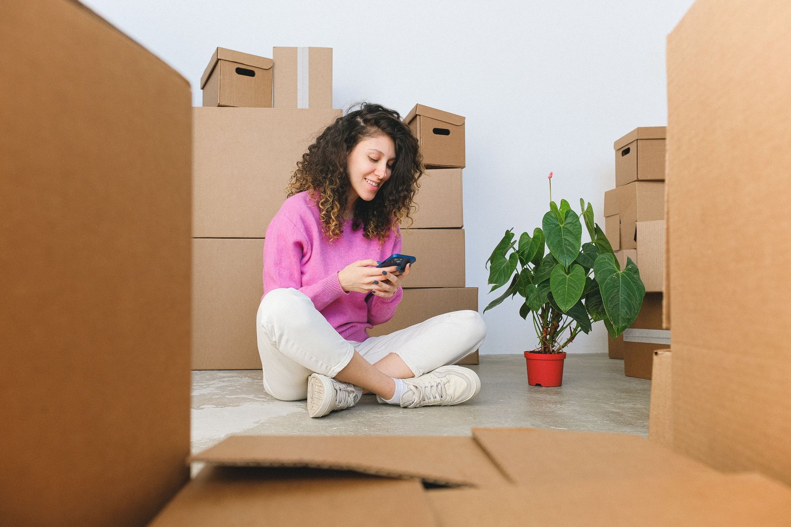 Happy homeowner using a phone representing customer reviews and trust